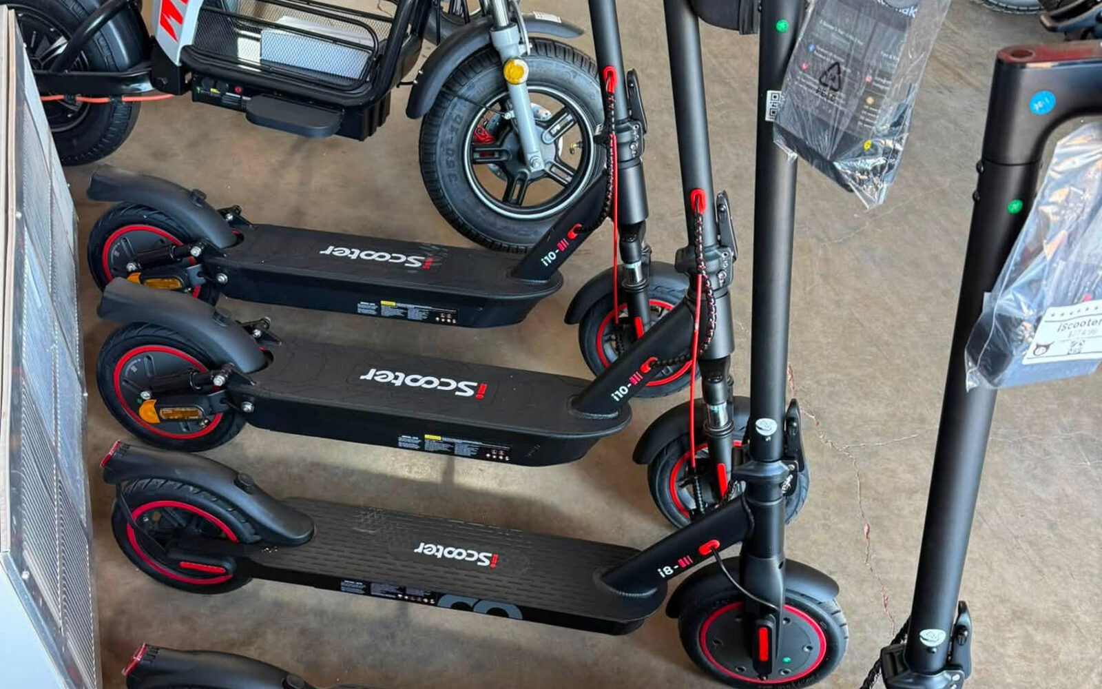 Electric scooters lined up for comparison inside E-Ride'z of Abilene