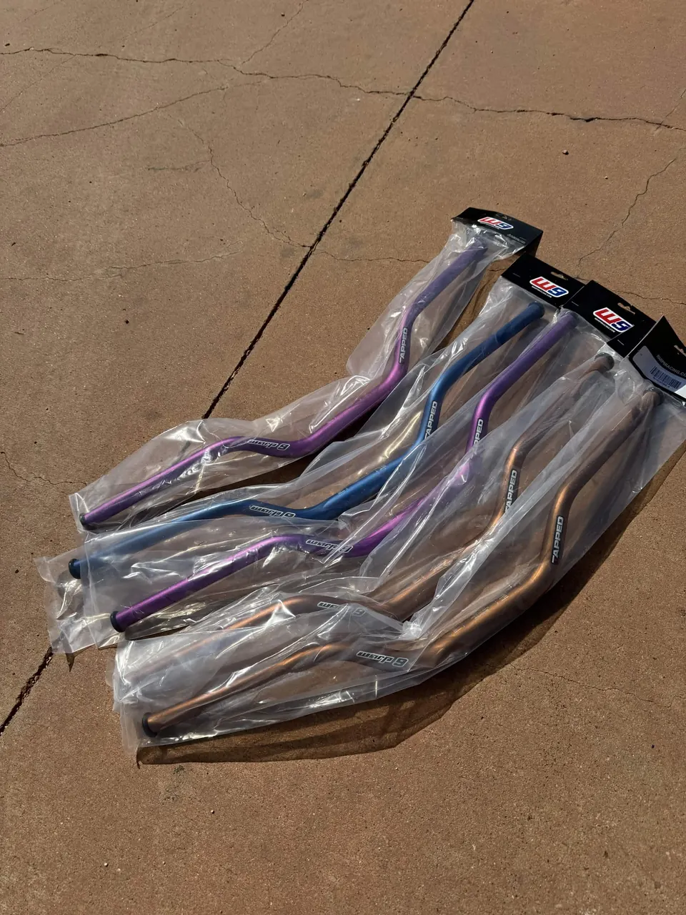 The iridescent finish on a set of handlebars at the shop