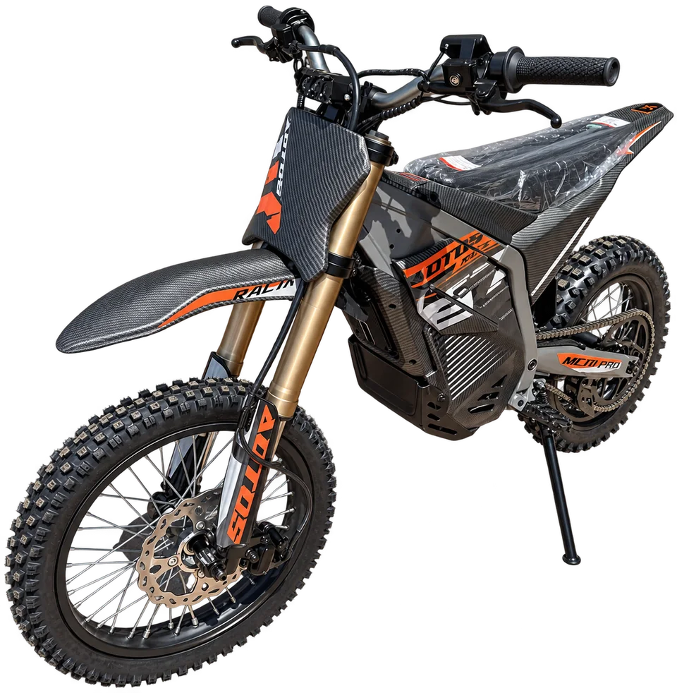 An electric dirt bike with knobby tires and gold suspension forks, isolated from our shop photograph